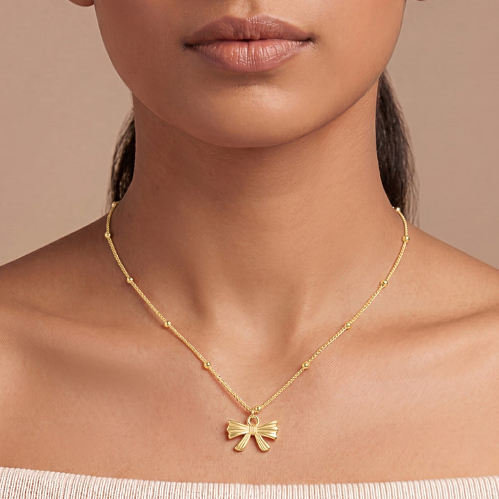 Cici Bow-Styled Gold Love Necklace