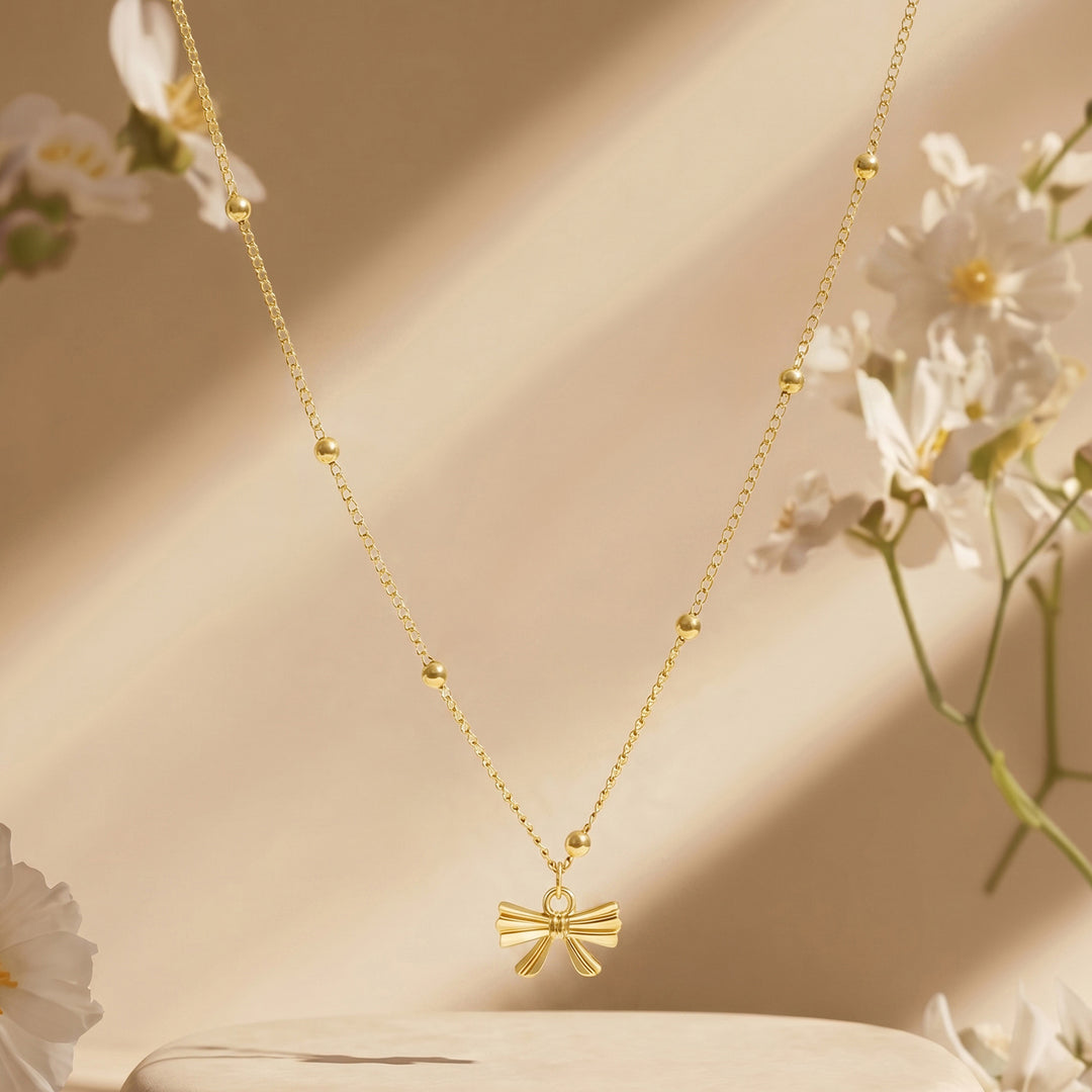 Cici Bow-Styled Gold Love Necklace