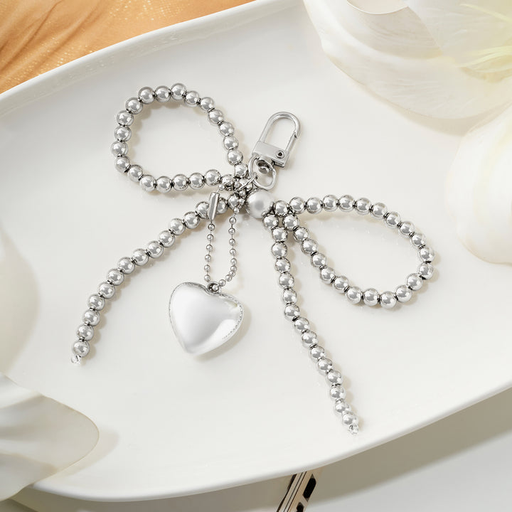 A Bow-Crush Silver Bag Charm