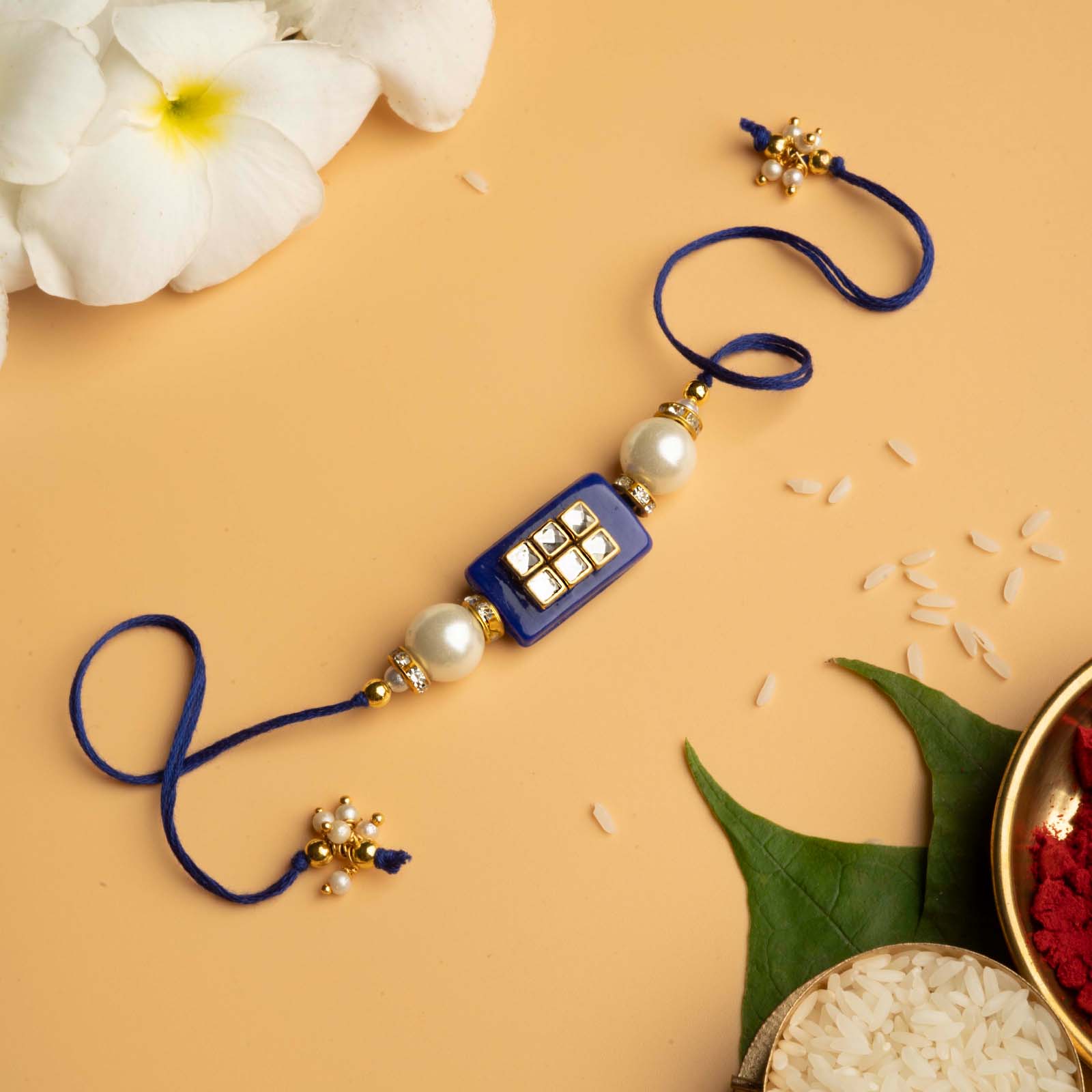 Teejh Rakshit Blue Pearl and Kundan Rakhi – Joker & Witch